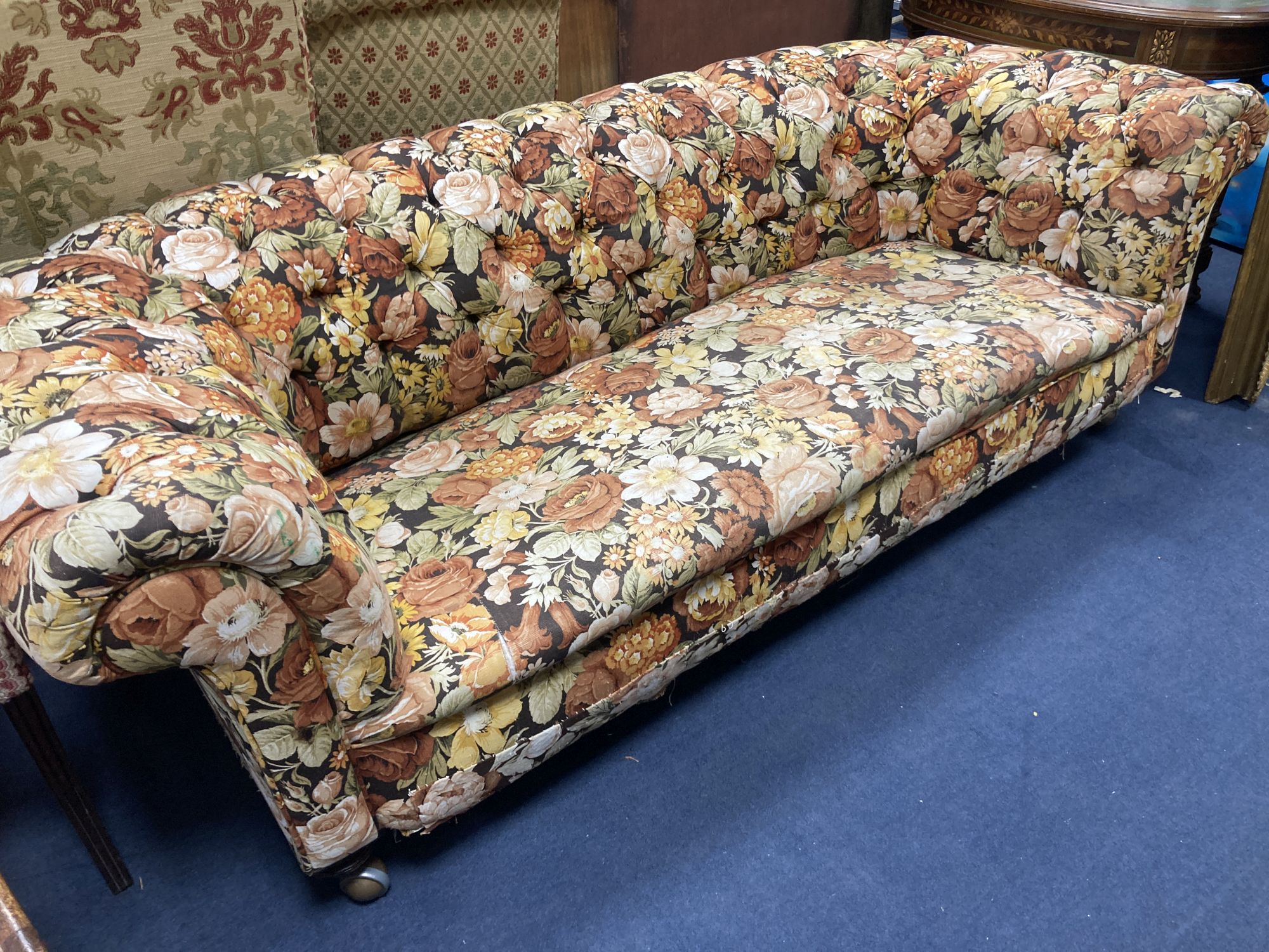 A Victorian floral upholstered Chesterfield settee, length 200cm, depth 85cm, height 68cm
